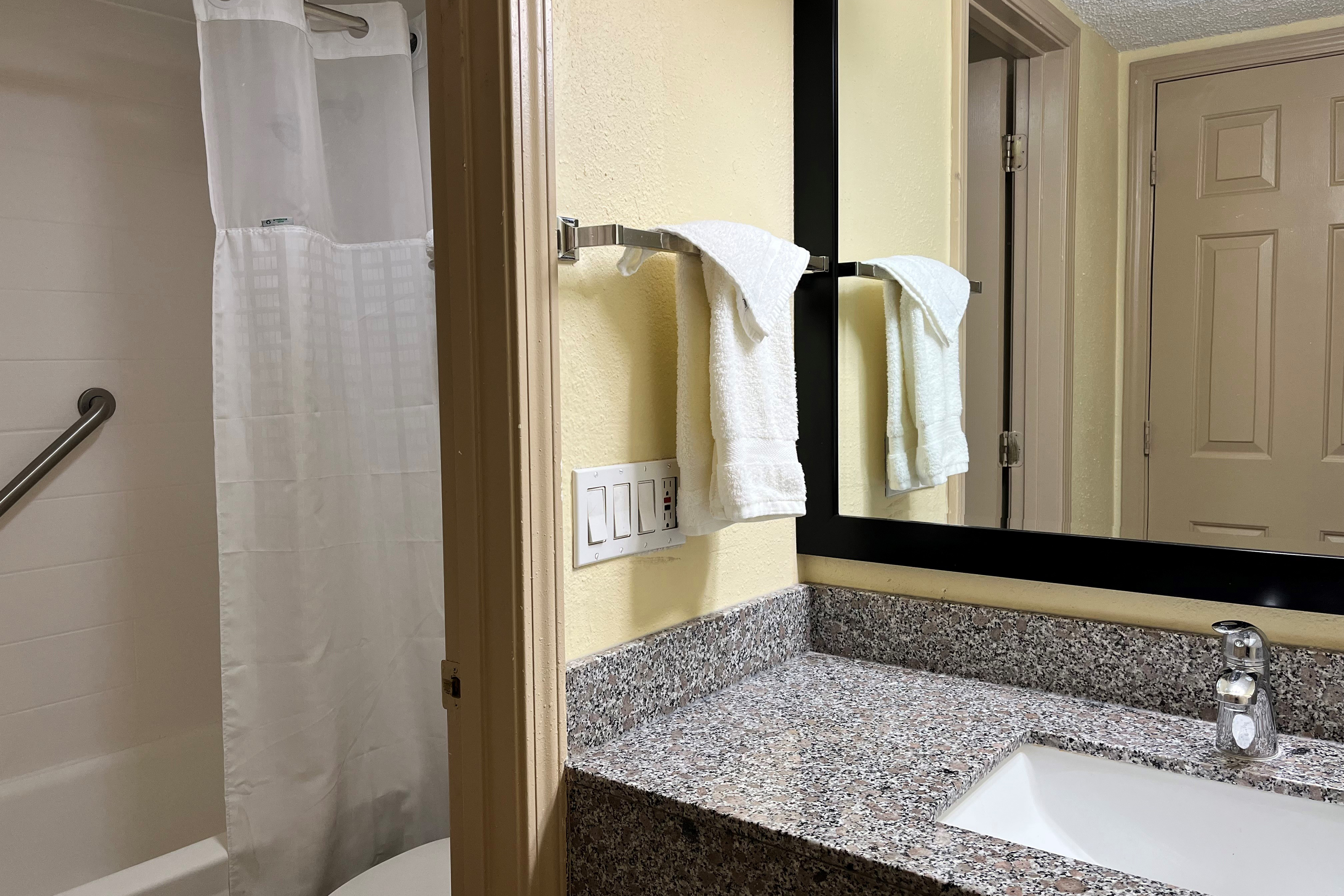 Guest room bath at the Baymont by Wyndham Indianapolis Airport Lynhurst in Indianapolis, Indiana